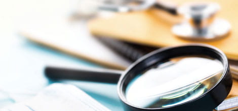 Magnifying glass and stethoscope